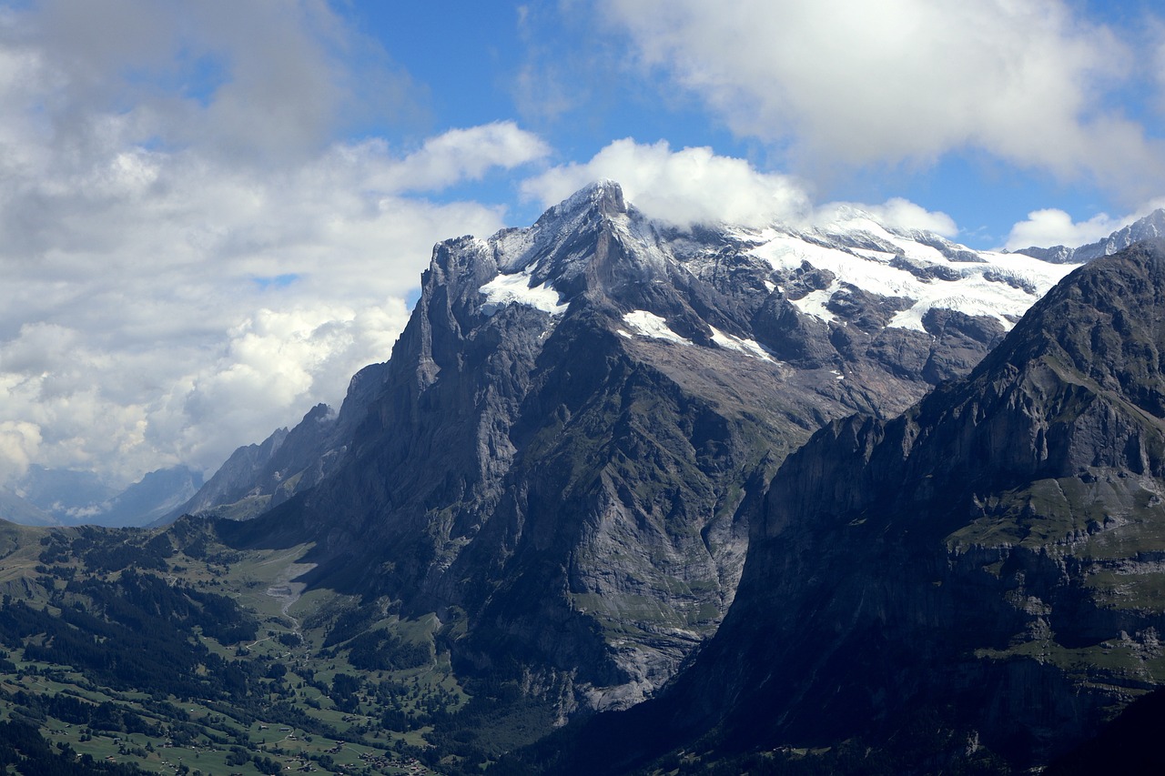 Snow capped mountain peaks in the Swiss Alps under a clear sky